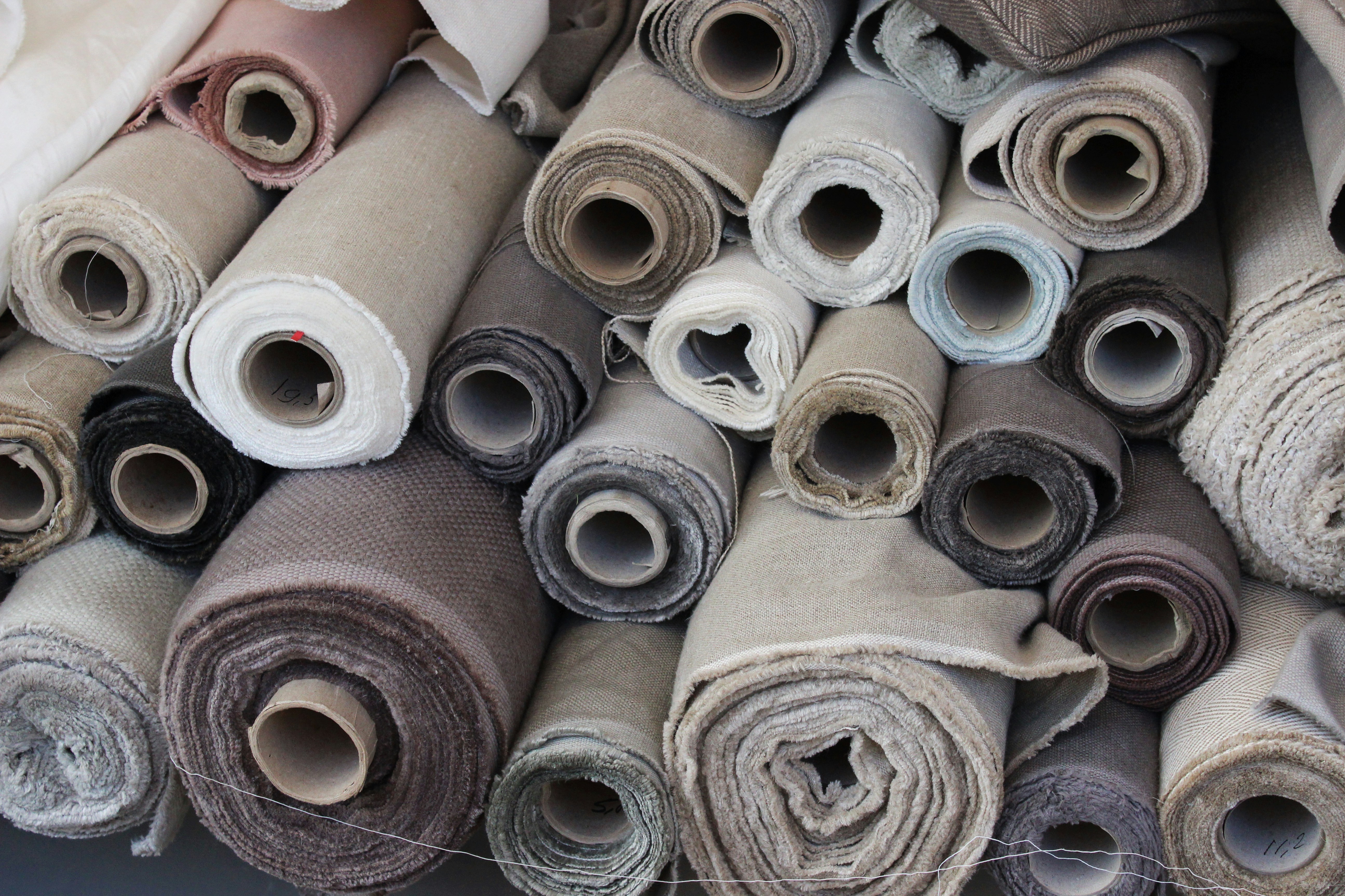 Premium carpet rolls with dense pile in various neutral colors