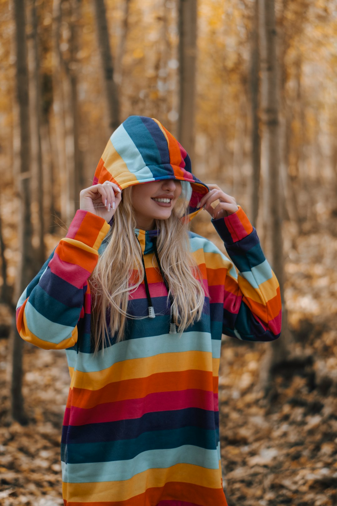 woman in orange and blue striped long sleeve shirt