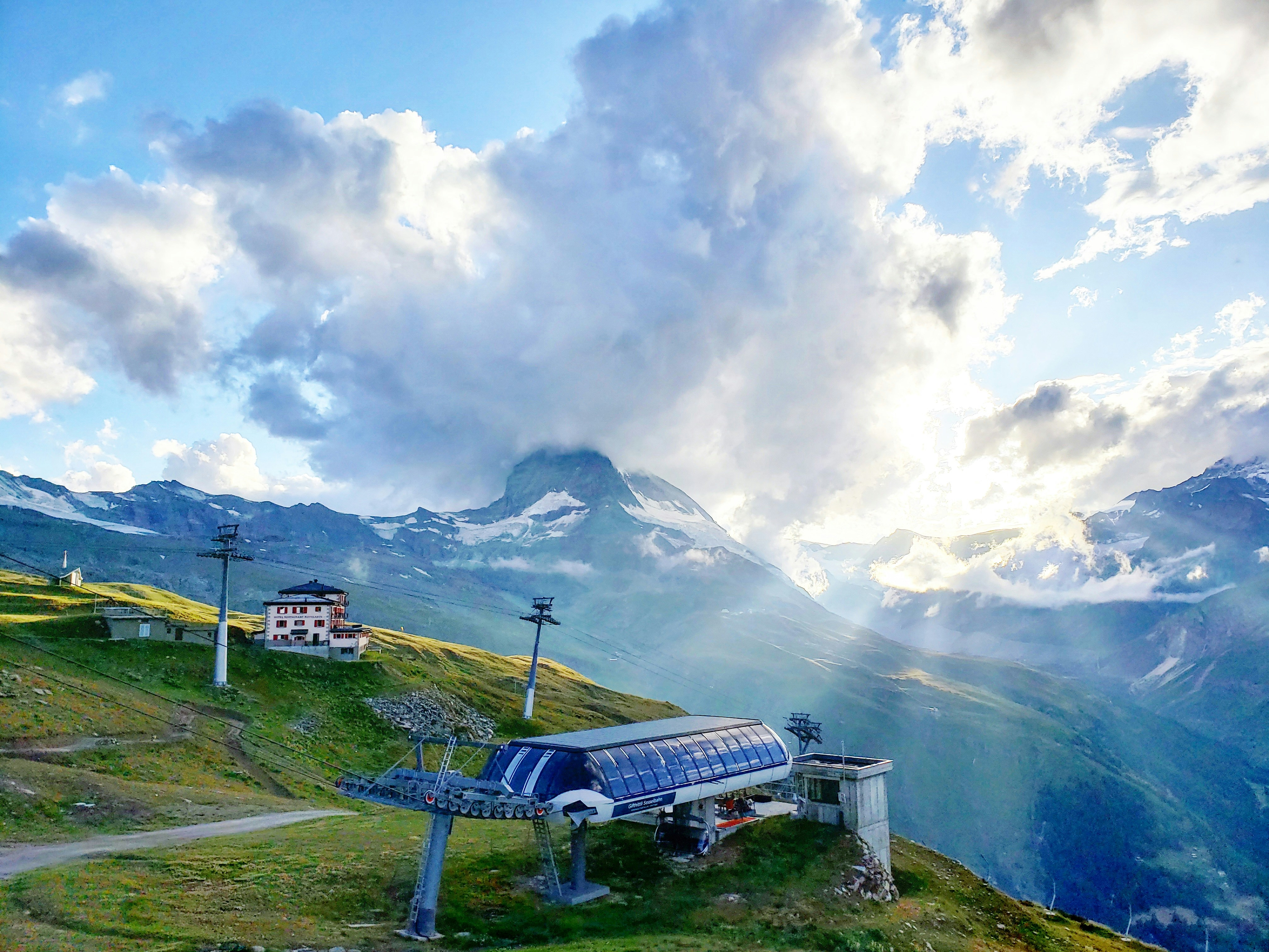 A mountain picnic table on the grass above Zermatt with the Matterhorn beyond