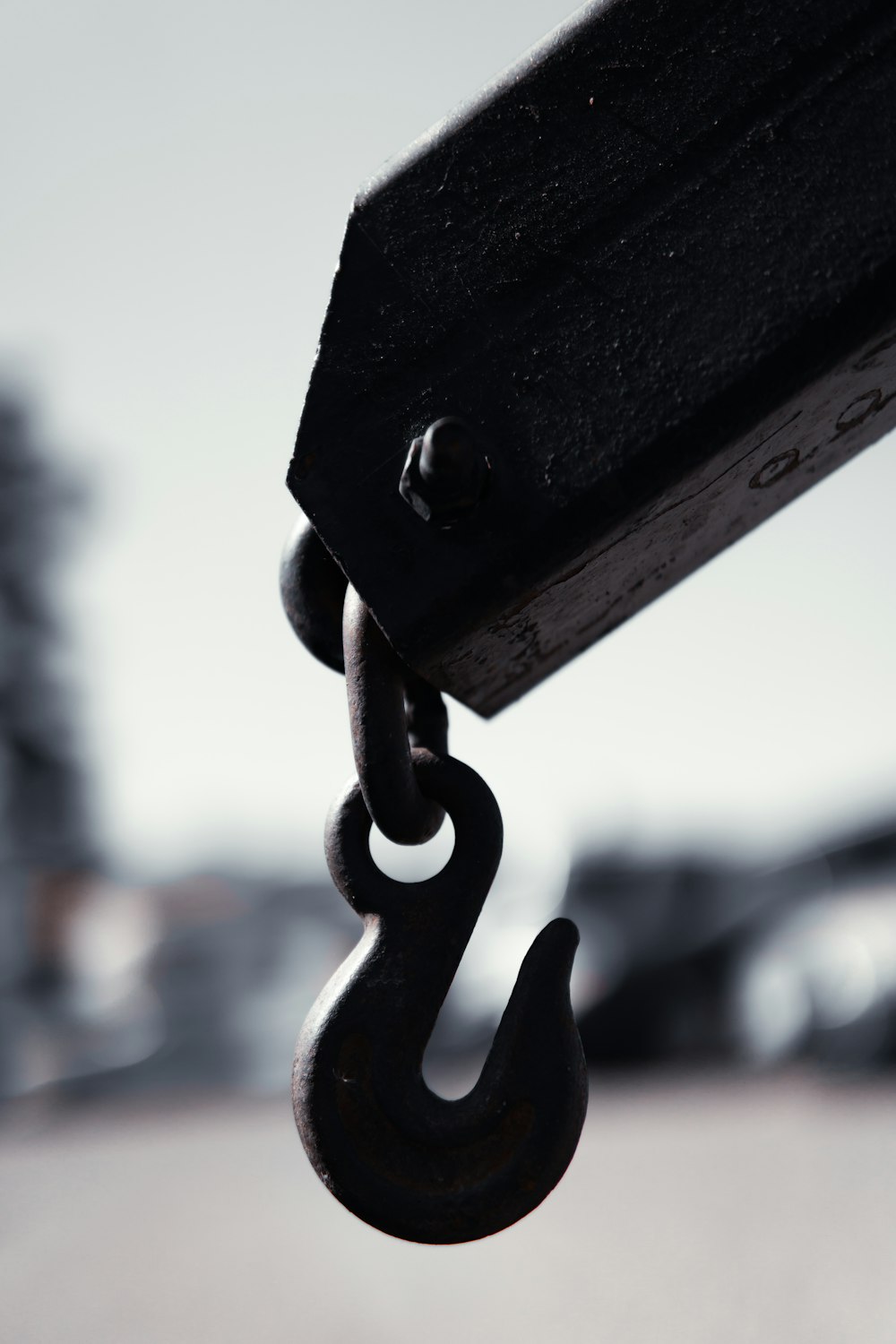 black metal padlock on black metal bar