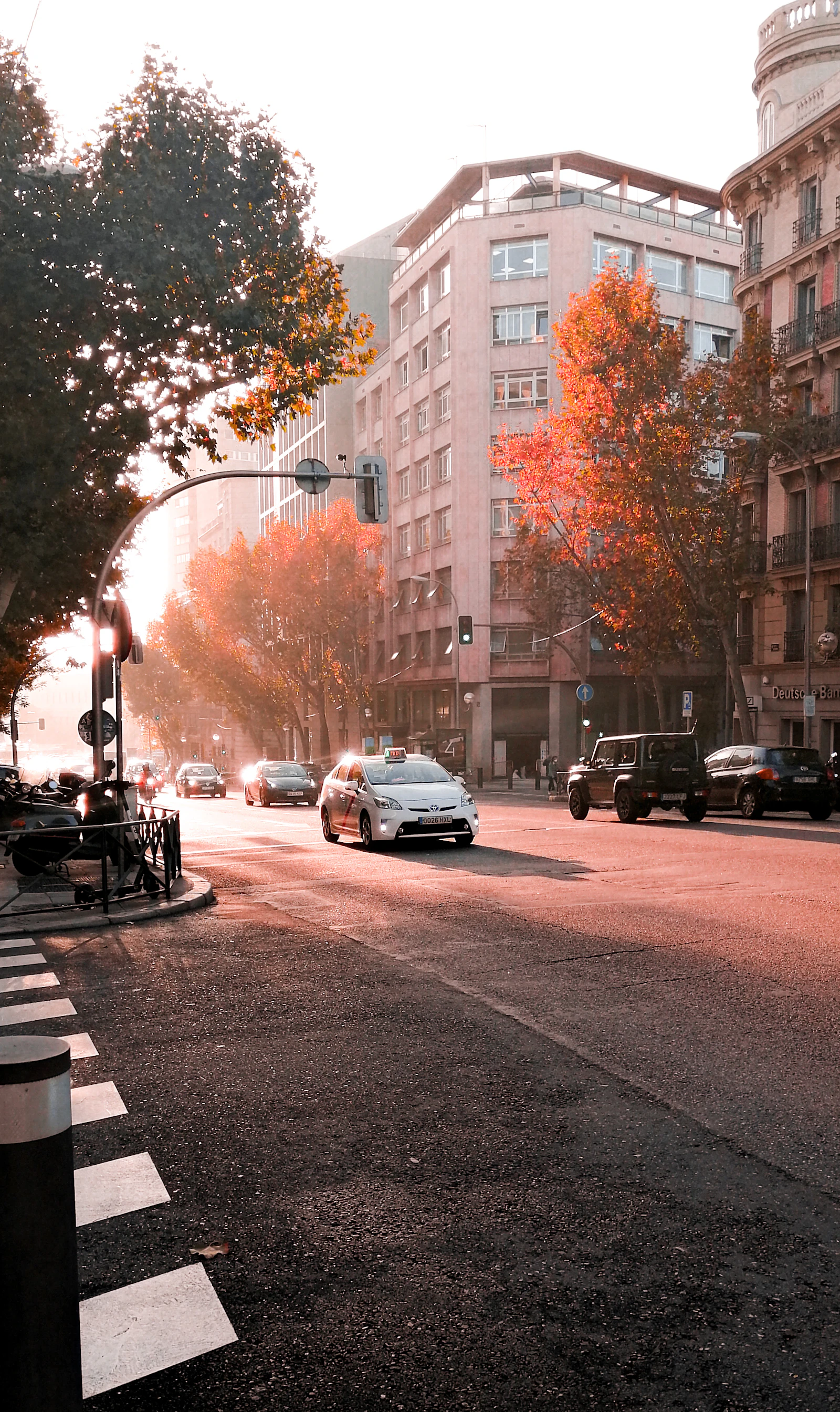 Morning traffic moves along a wide road in Madrid