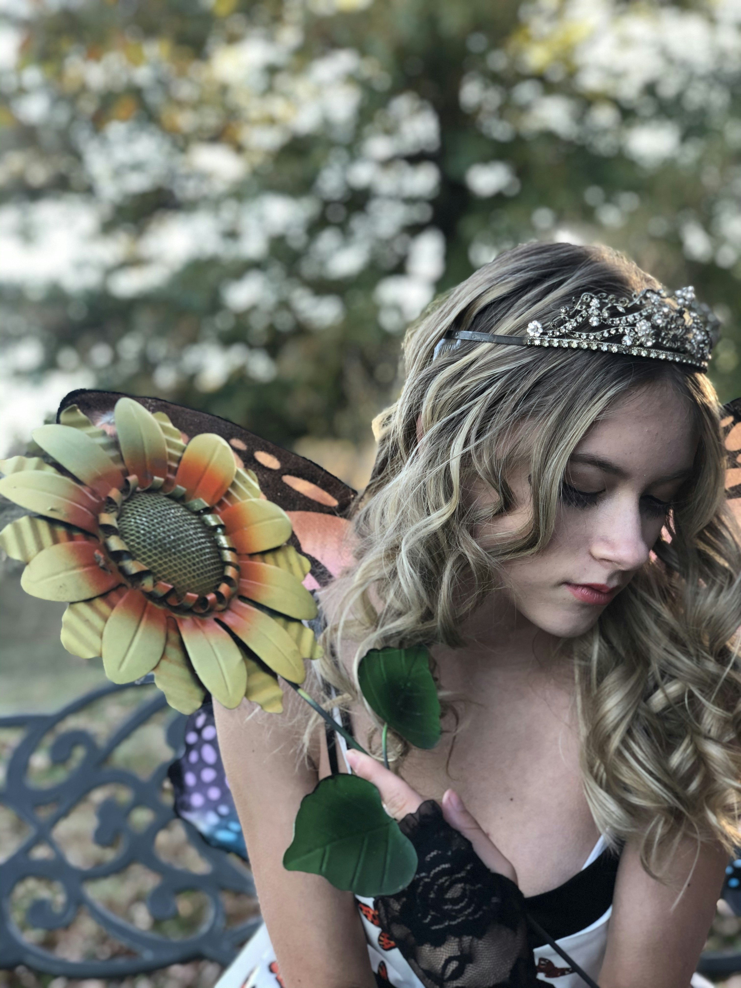 woman in white and yellow floral headdress