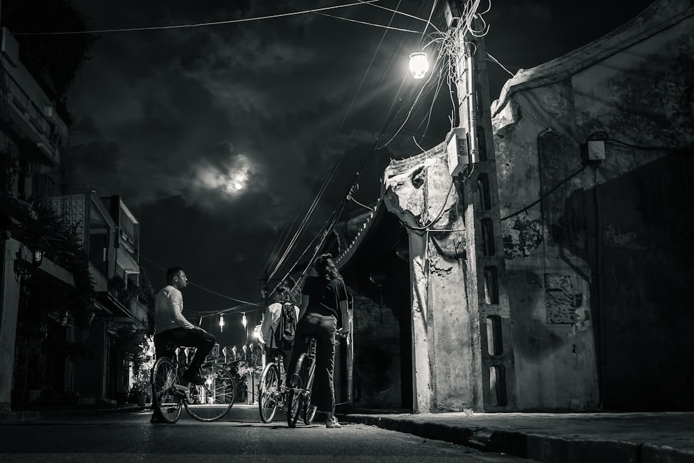 people walking on street during night time