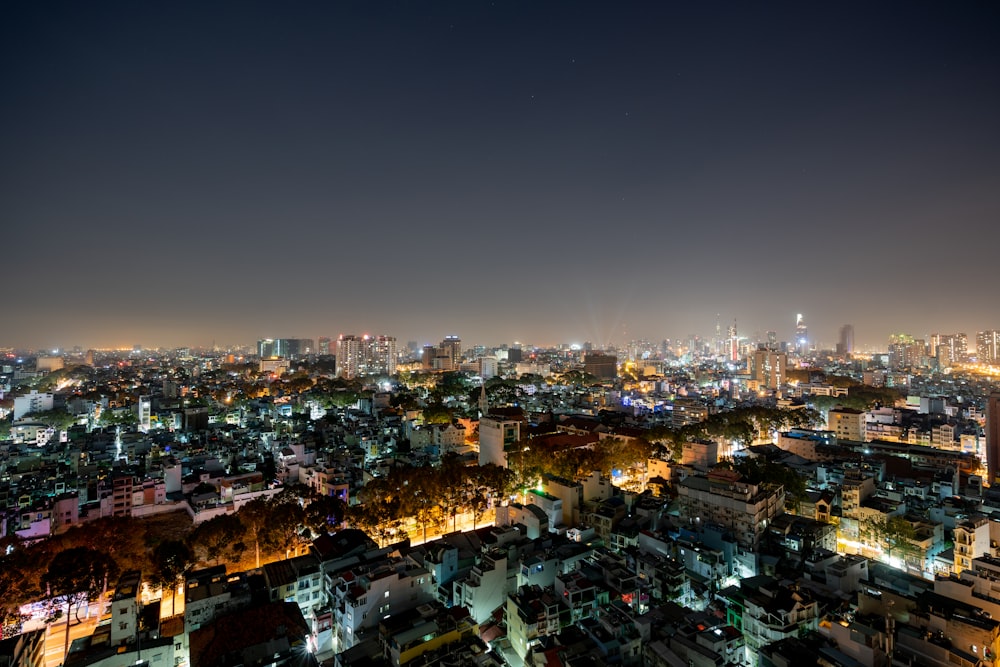 city with high rise buildings during night time