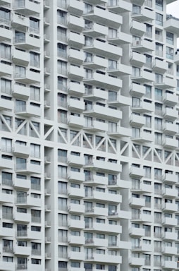Exterior of a modern multifamily apartment building with balconies.