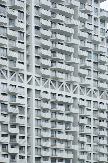 The exterior view of a modern apartment building with clean lines and inviting balconies.