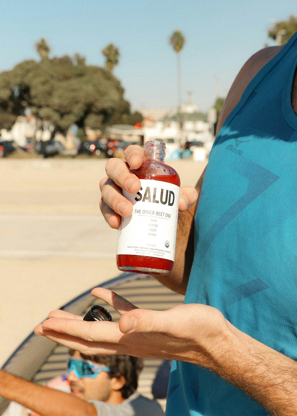 person holding white and brown bottle