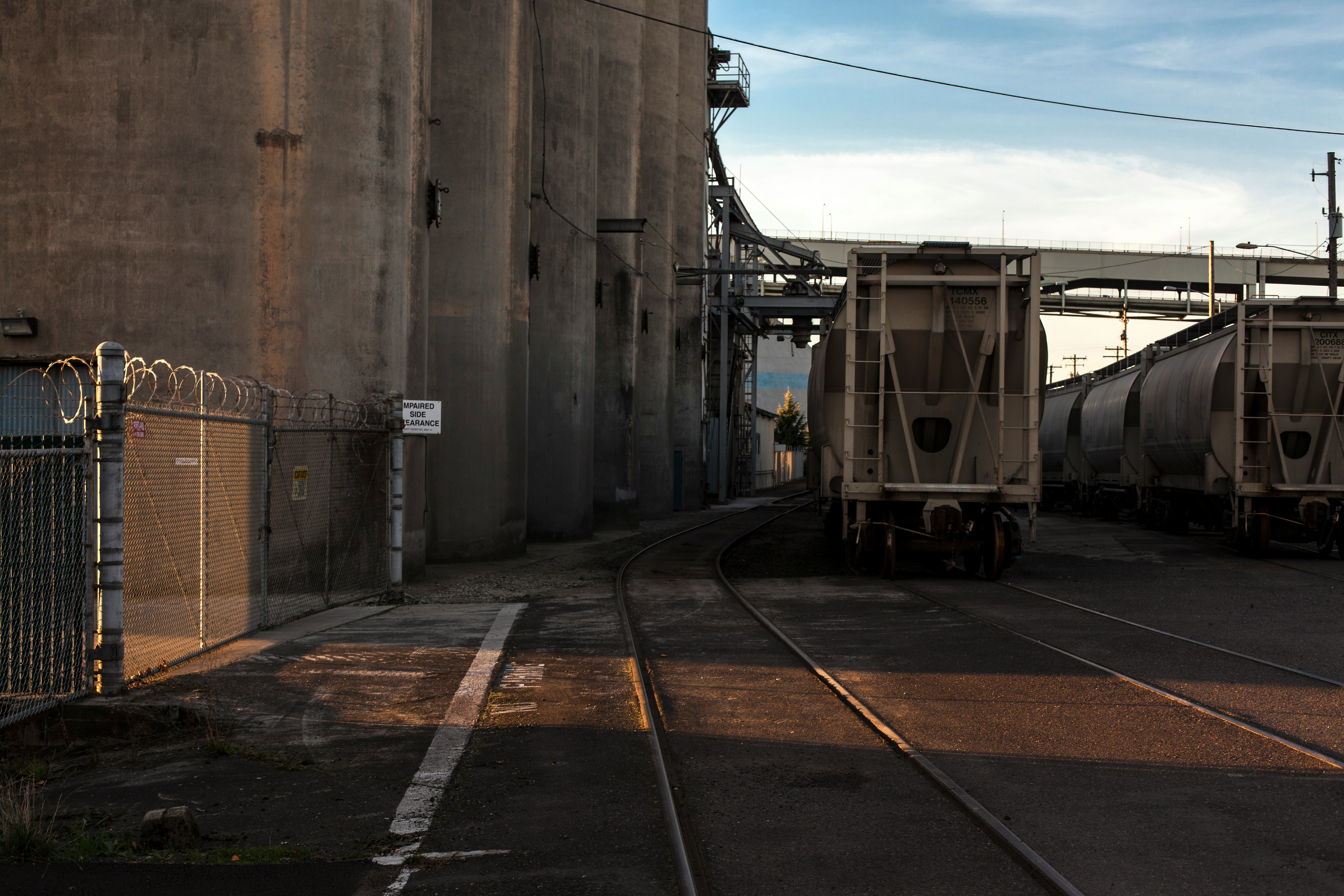 white train on rail road during daytime