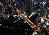 Night view of Buenos Aires skyline with illuminated landmarks and lively streets.