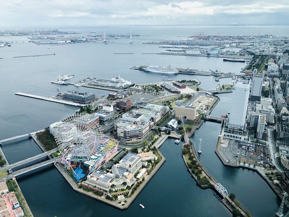 aerial view of city buildings near body of water during daytime