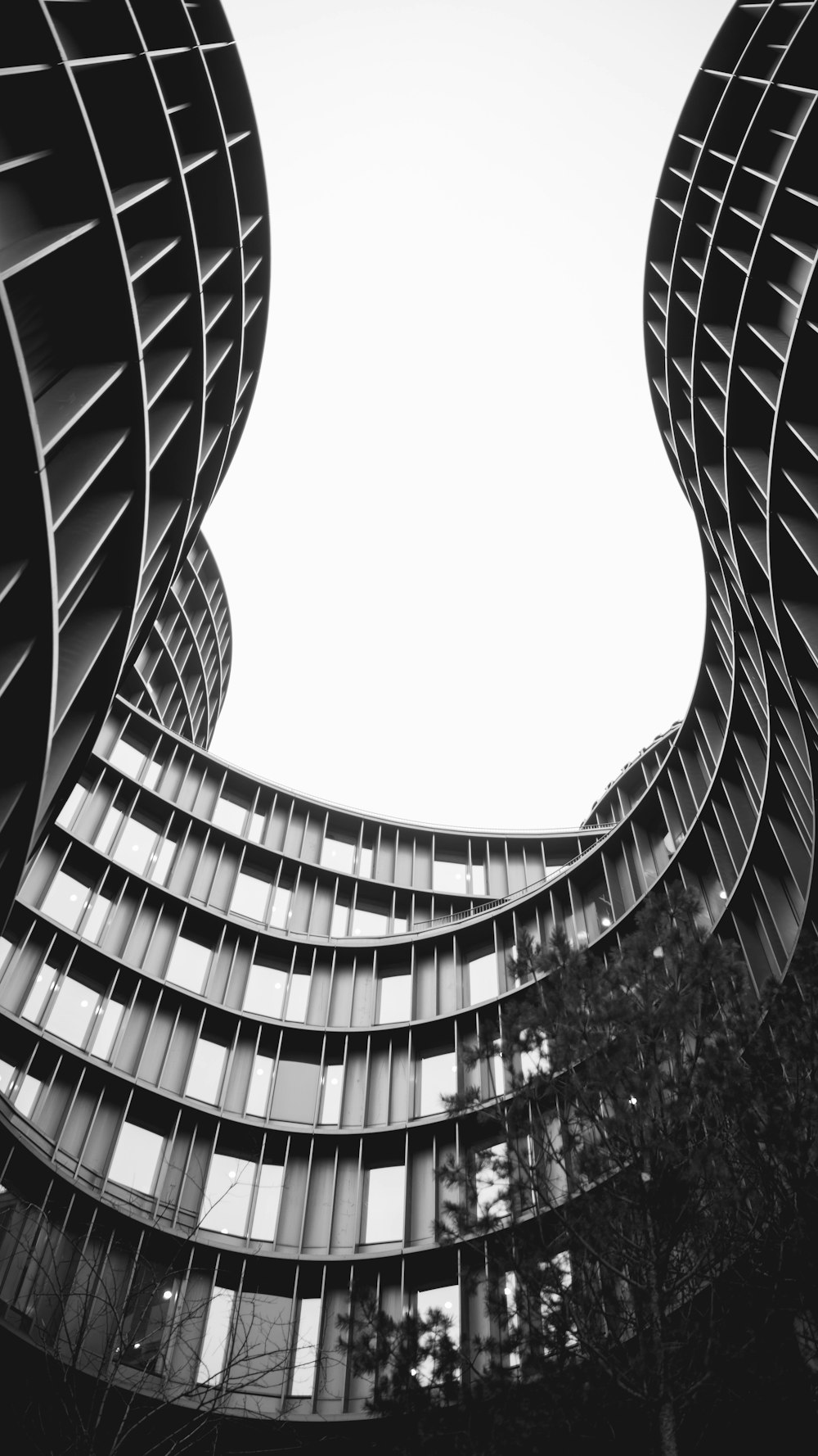 grayscale photo of spiral stairs