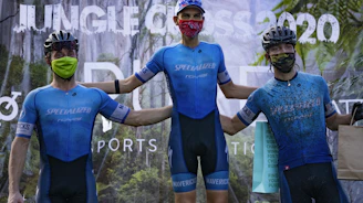 man in blue and black long sleeve shirt and black shorts with red helmet