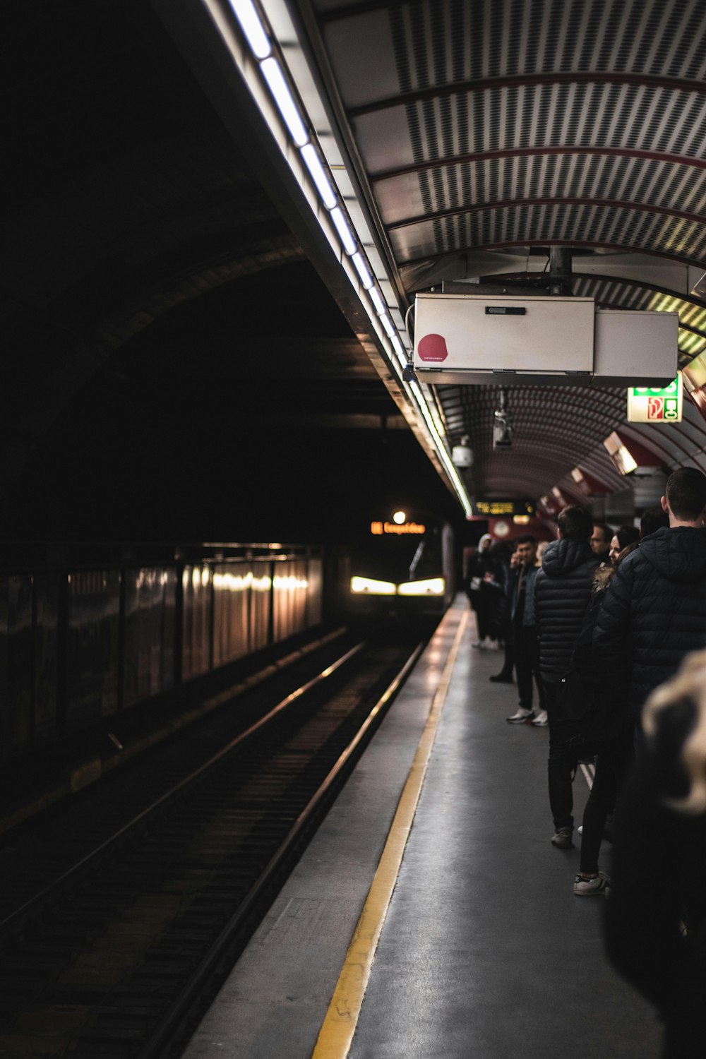 people walking on train station