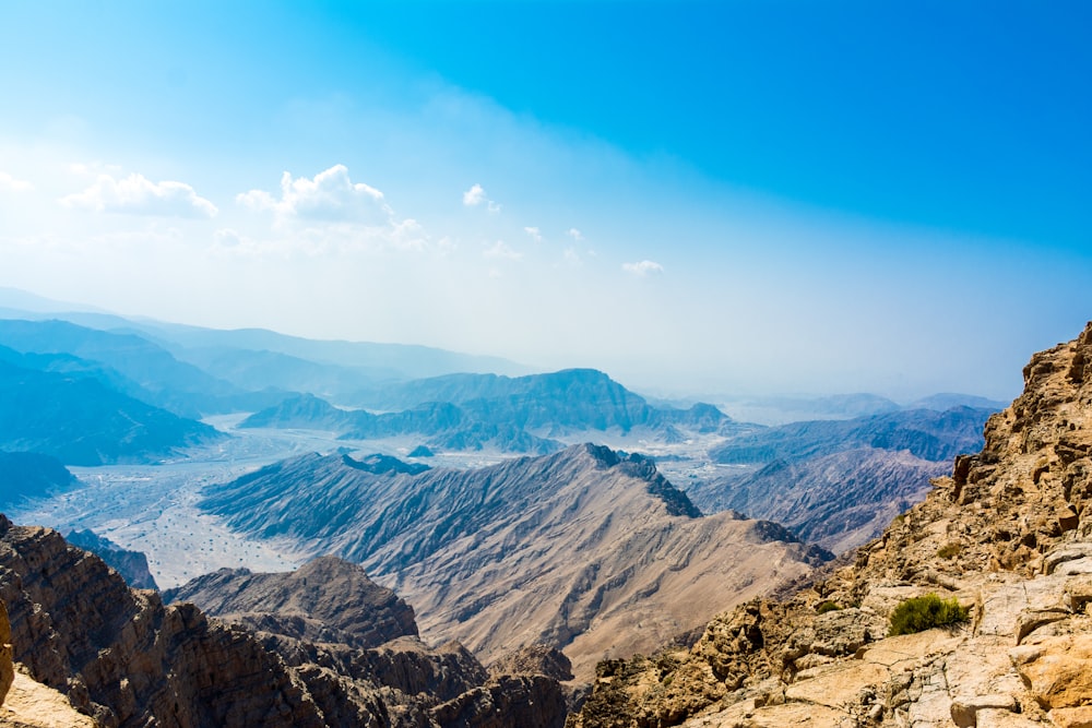 brown and green mountains under blue sky during daytime