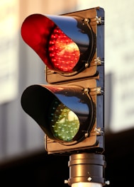 Close-up of a modern LED traffic light installed on a busy urban street.