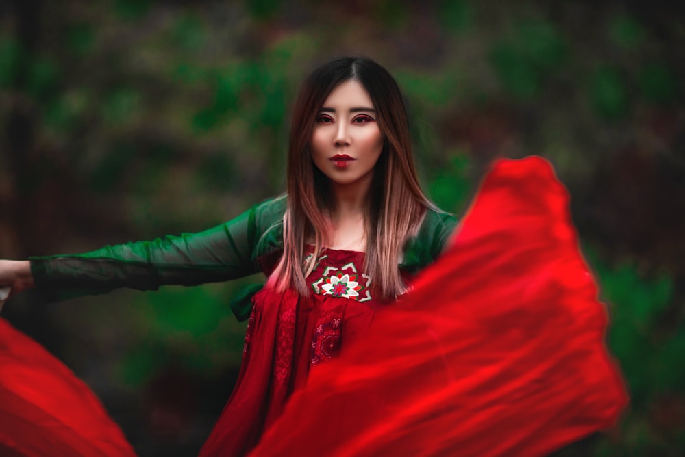 woman in red long sleeve dress