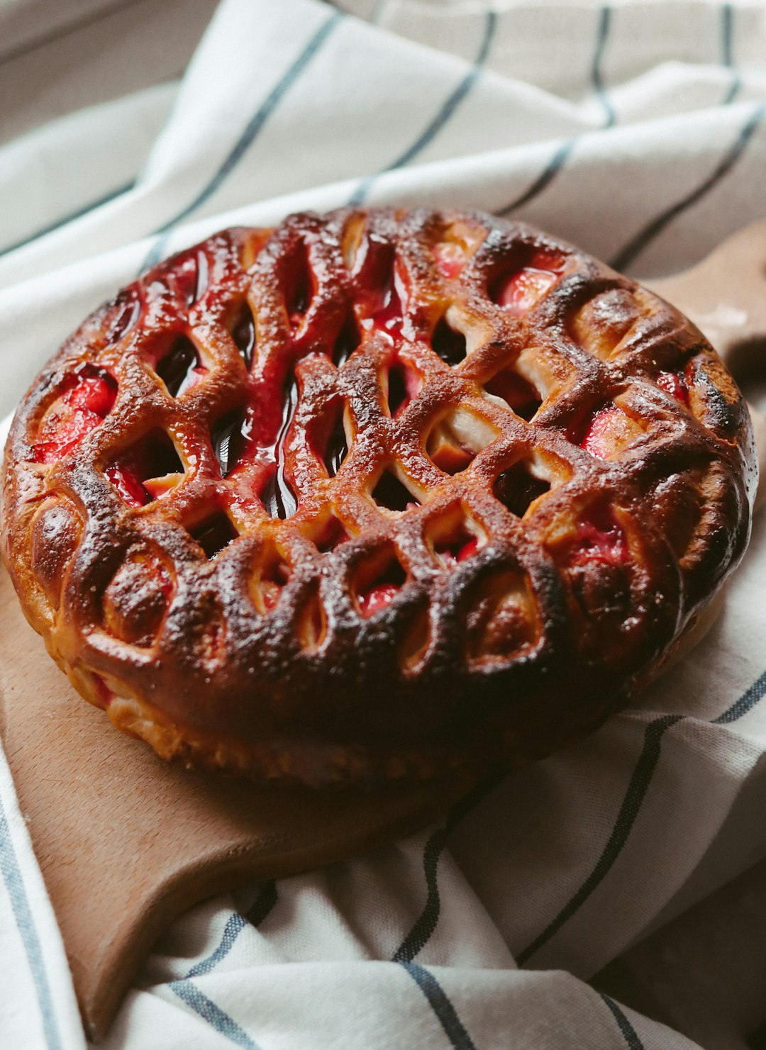 brown and red round cake on white paper towel