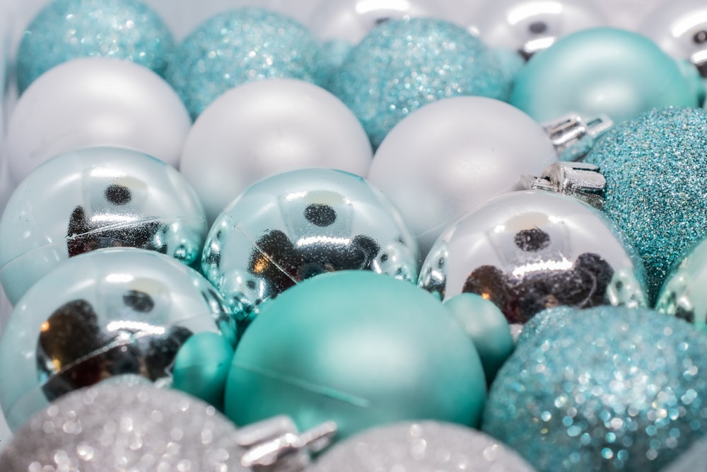 silver and green baubles on green plastic clothes hanger