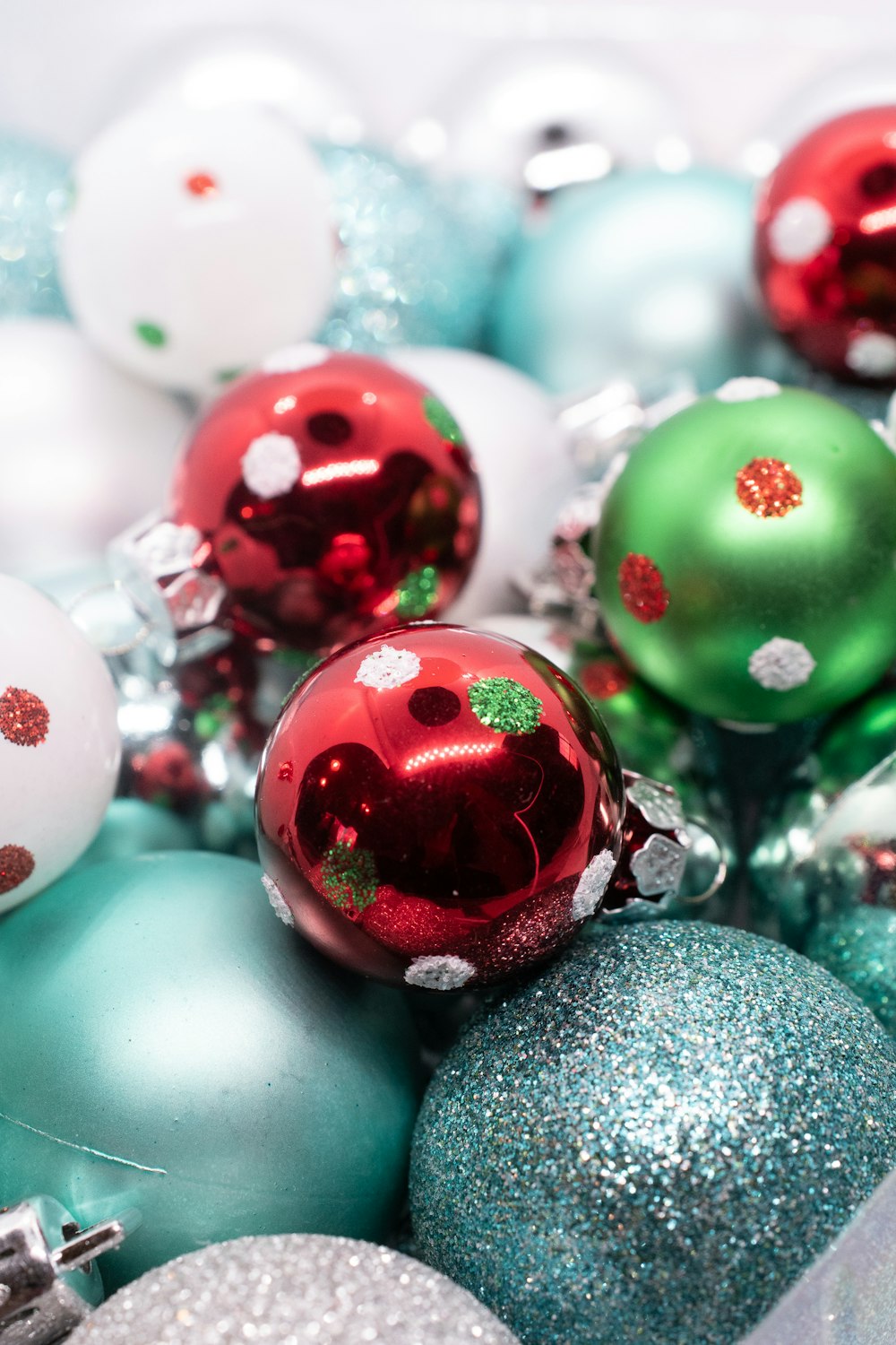 green and red baubles on gray textile