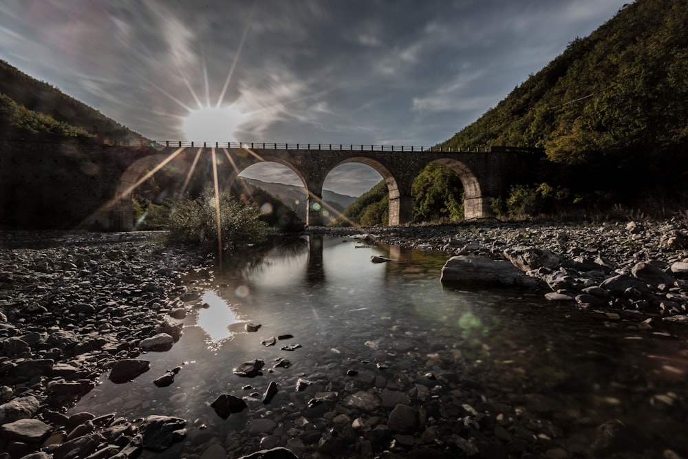 gray concrete bridge over river