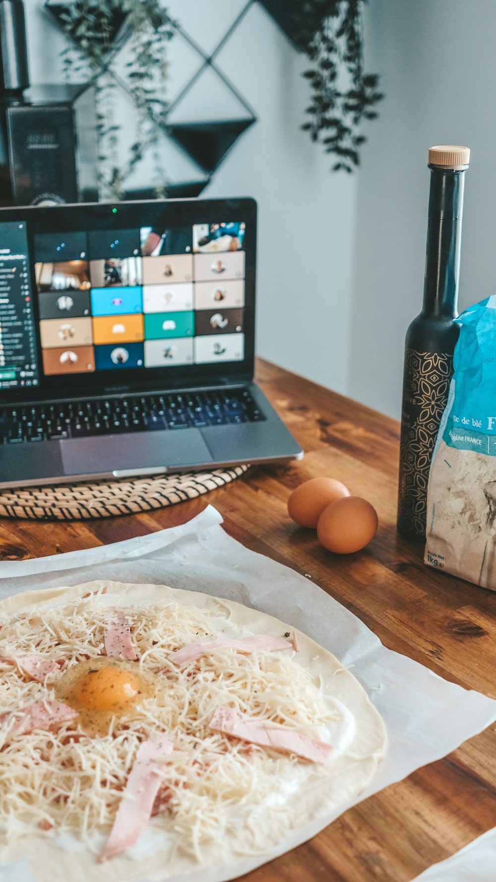 black laptop computer beside brown egg on white paper