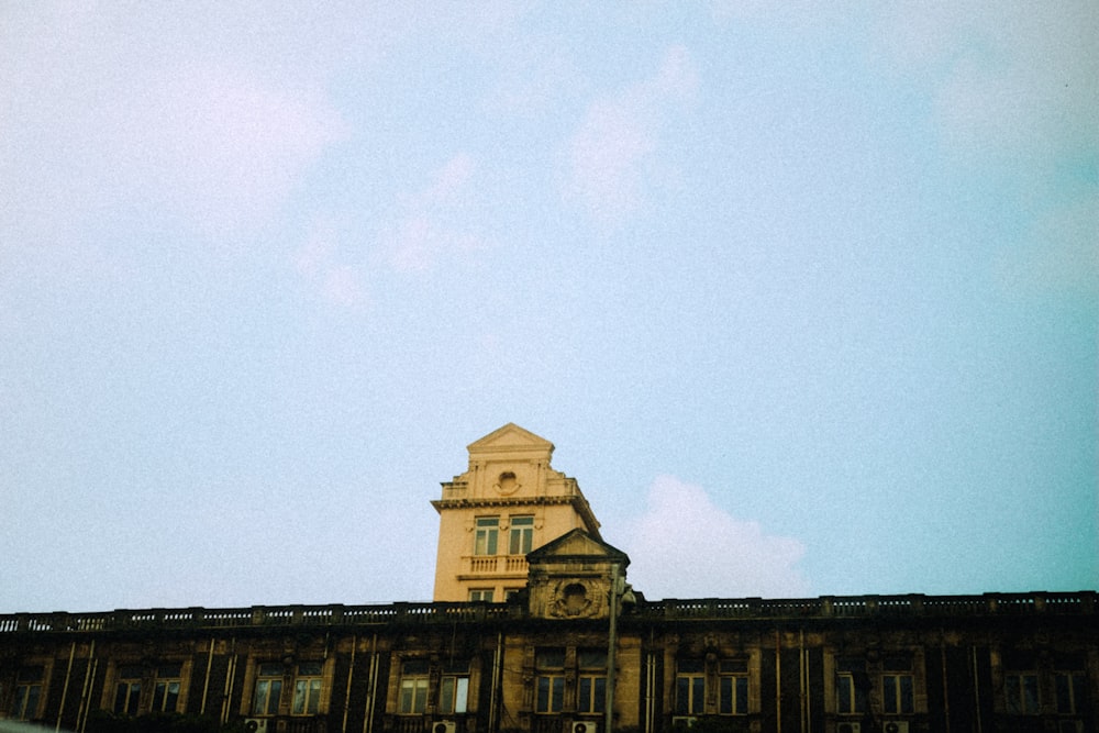 brown concrete building under white sky during daytime