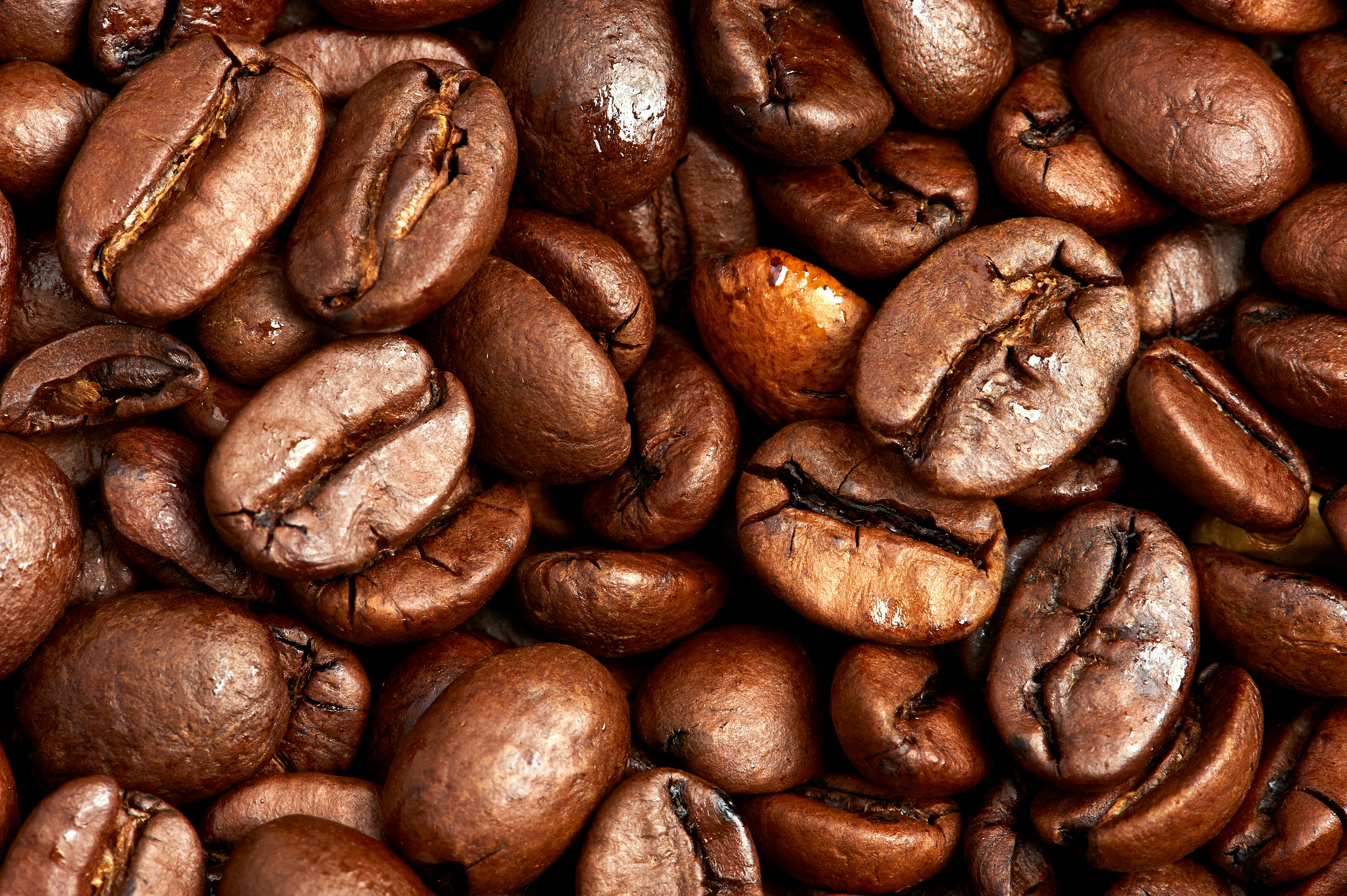 brown coffee beans on brown wooden table