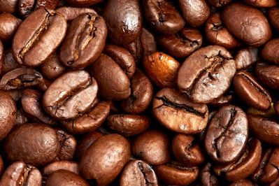 brown coffee beans on brown wooden table