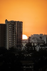 silhouette of city buildings during sunset