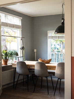 black metal framed white padded chairs