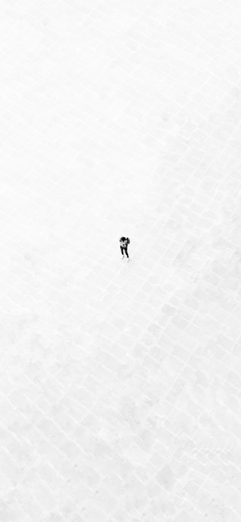 person walking on white floor
