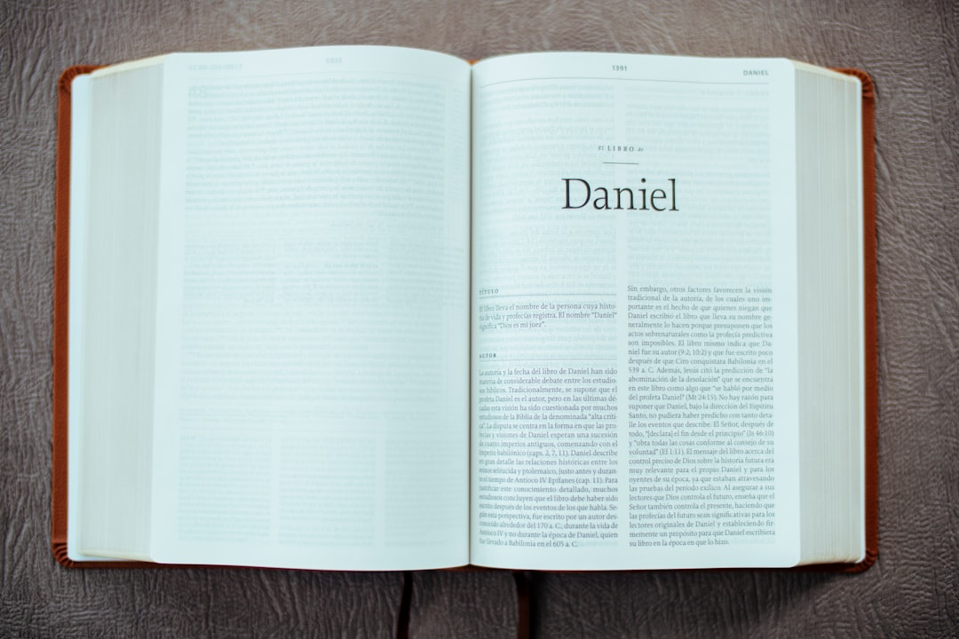 white book page on brown wooden table