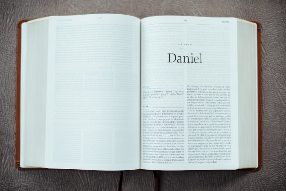 white book page on brown wooden table