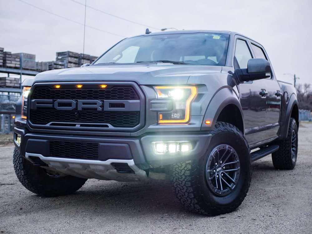 black chevrolet crew cab pickup truck on road during daytime