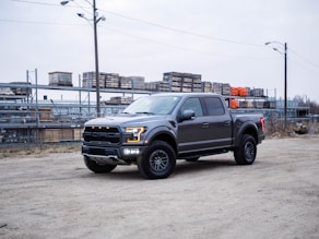 black chevrolet crew cab pickup truck on road during daytime