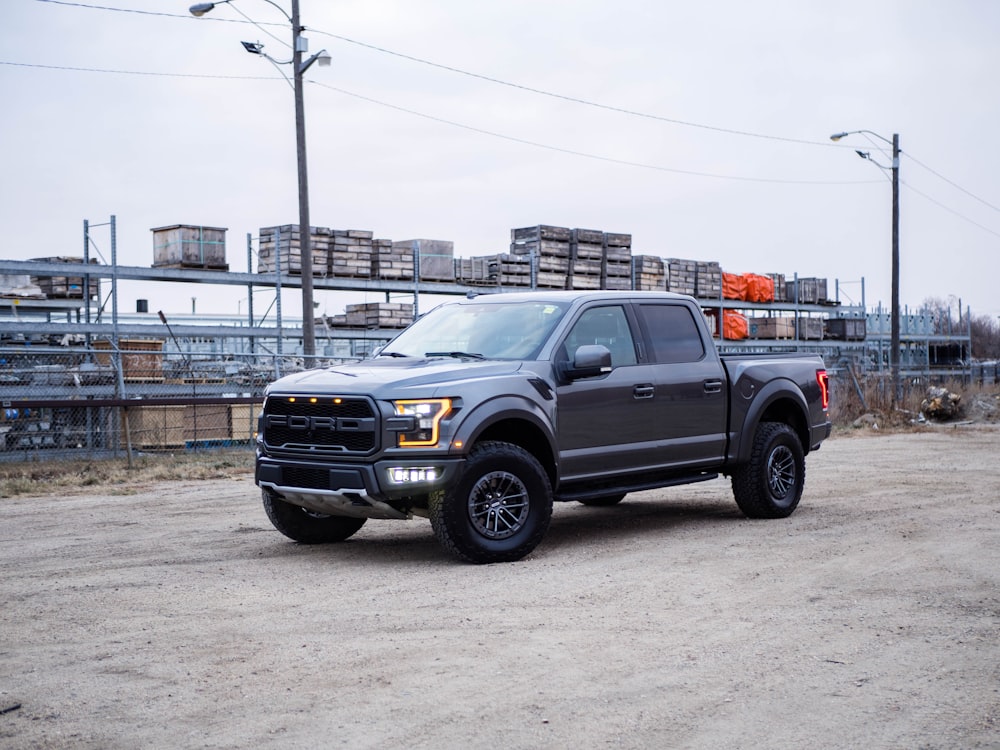 black chevrolet crew cab pickup truck on road during daytime