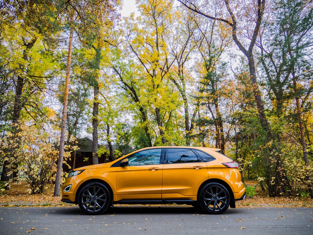 yellow car parked on the side of the road