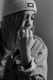 woman in denim jacket with knit cap
