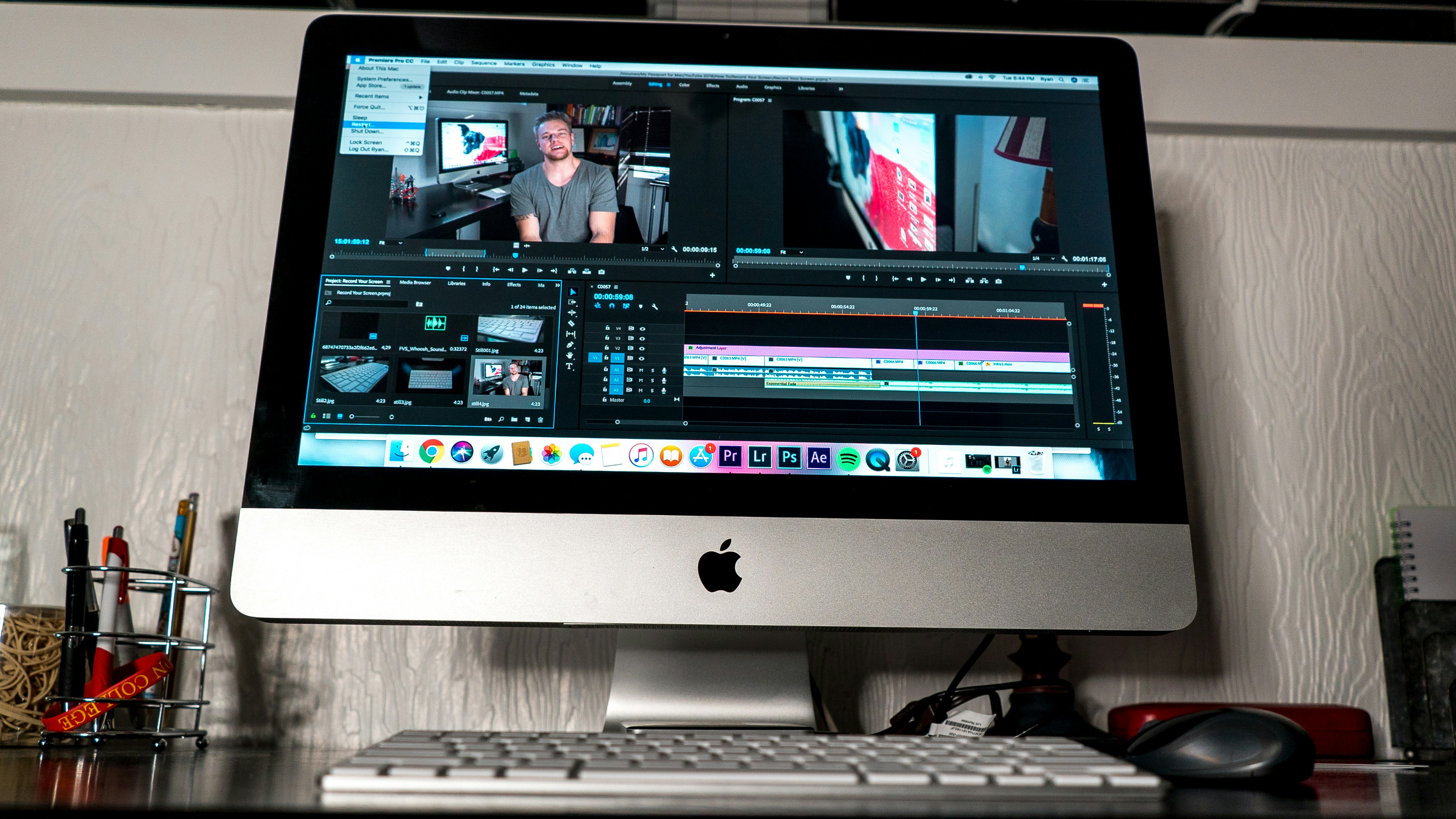 Video editor working on professional editing software with multiple monitors