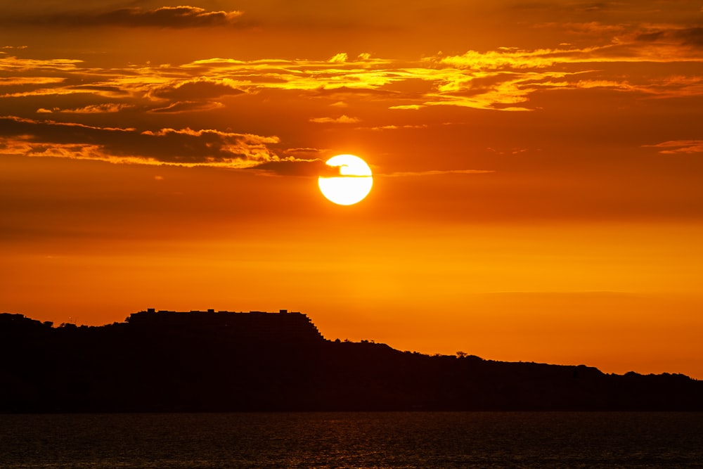 silhouette of mountain during sunset