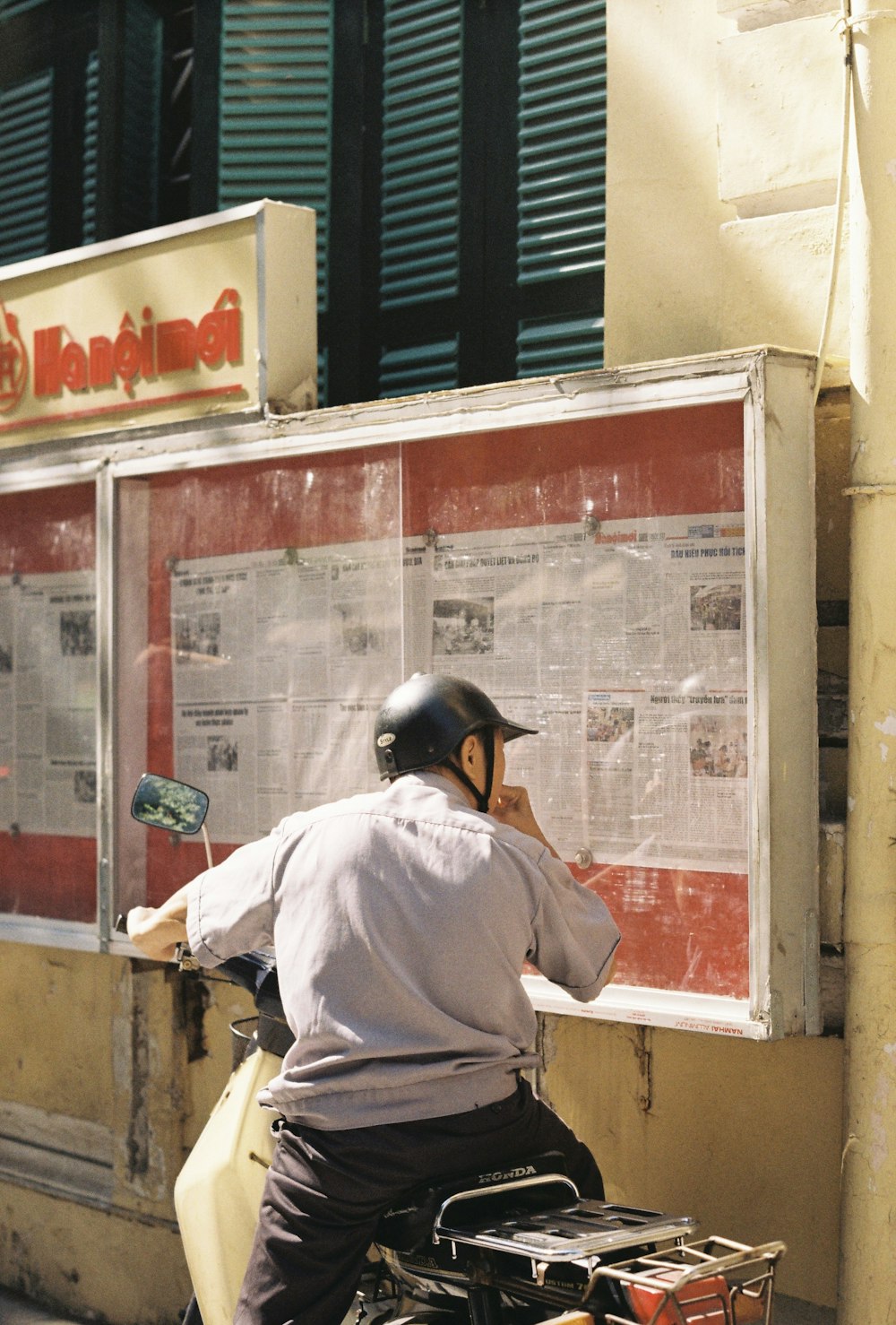 man in white shirt wearing black helmet