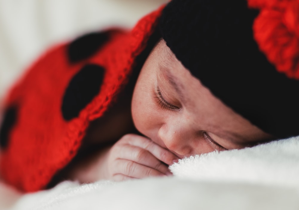 baby in black knit cap