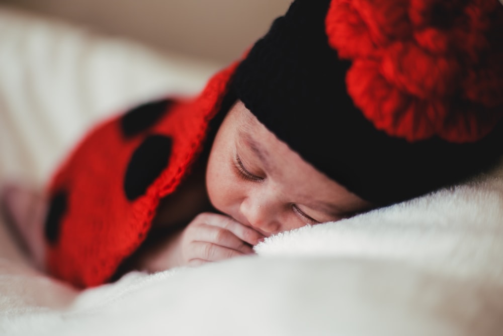 baby in black knit cap