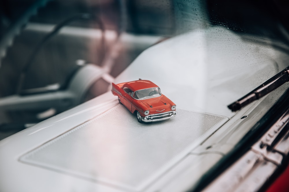 red car on road during daytime