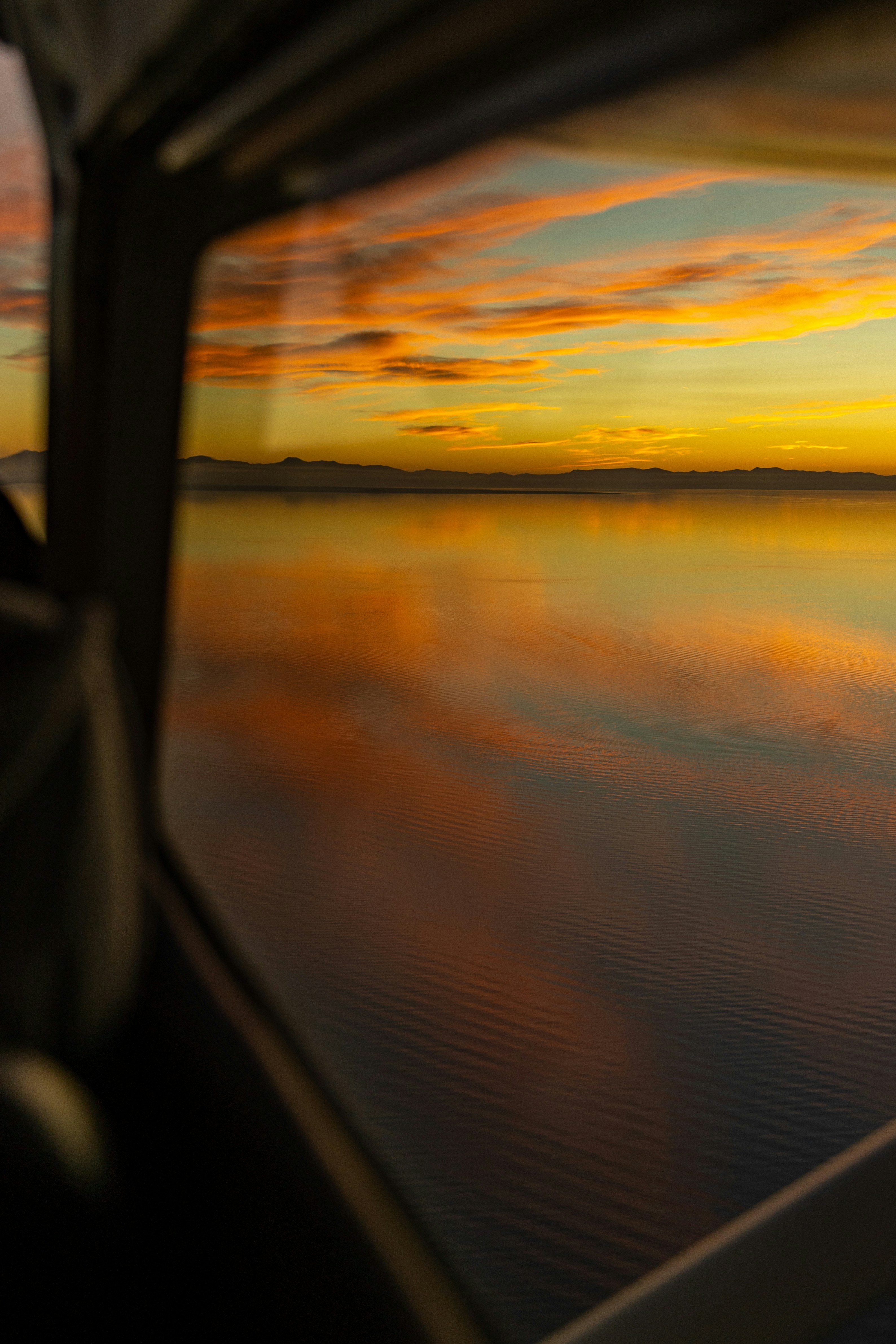 body of water during sunset
