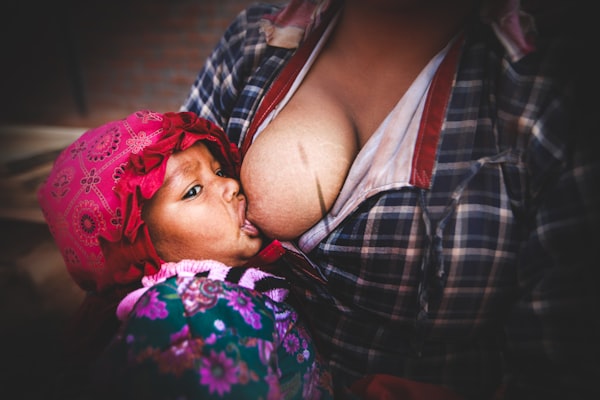 leaking breasts, large breasts, mother breastfeeding