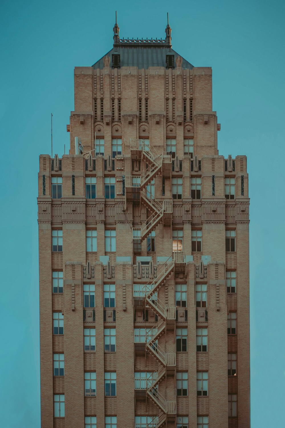 brown concrete building under blue sky during daytime