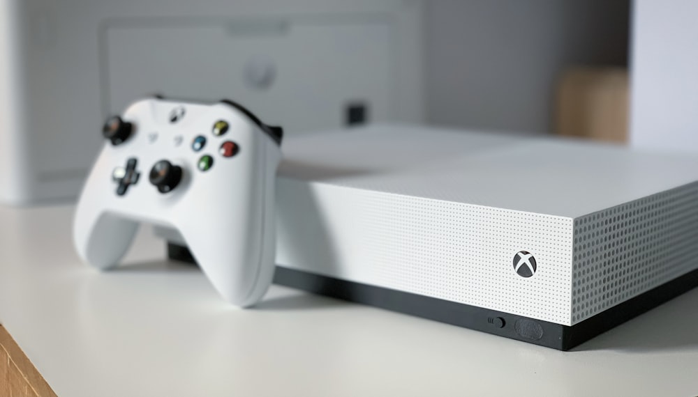 white xbox one console on white table