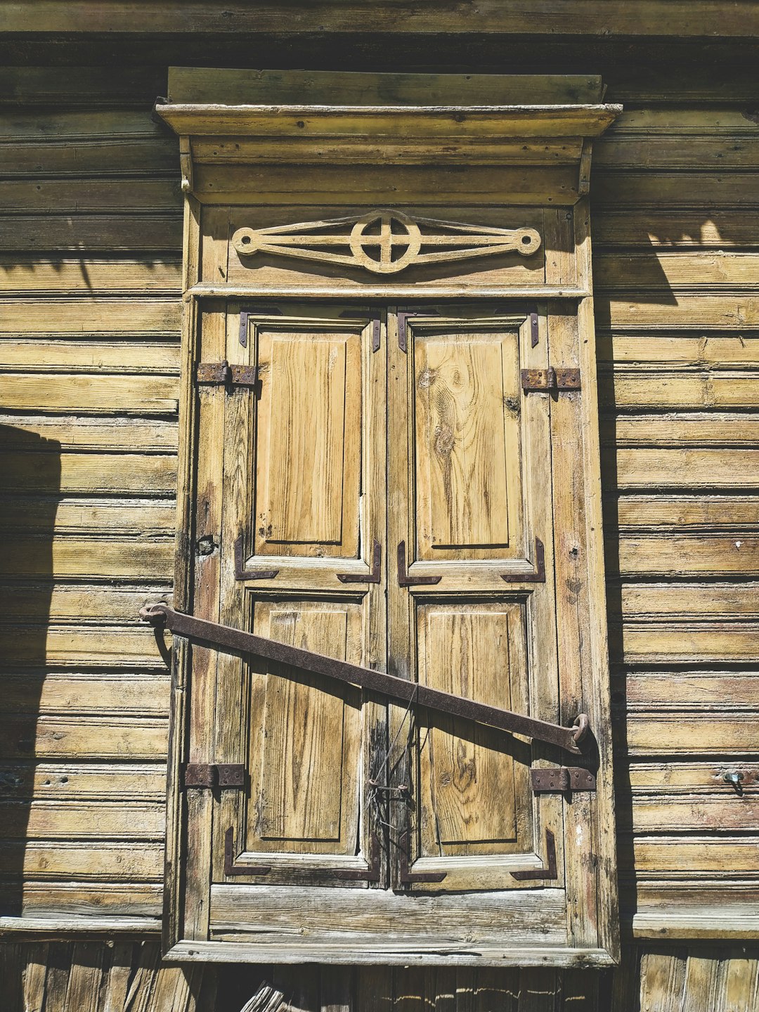 brown wooden door with black metal door lever