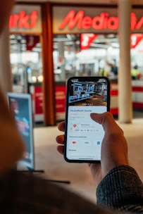 A smartphone showing a Google My Business profile with positive reviews and location map.